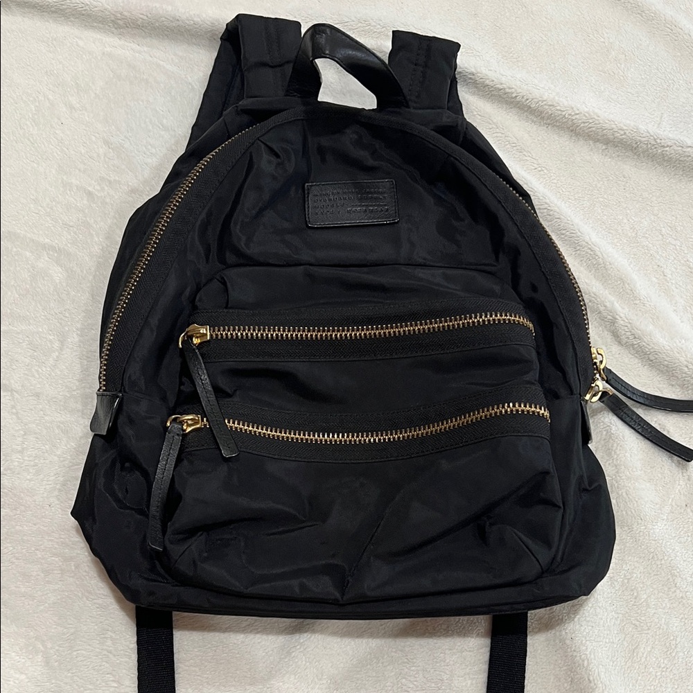 Nylon Backpack. Used. Good condition. It’s been washed and inside reflects it.